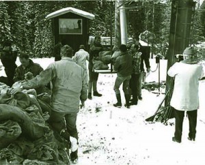 Building the first chairlifts in Vail: The power source is installed and workers use bags of boulders to test their operation