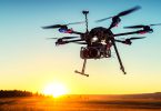 A drone flying above grasslands