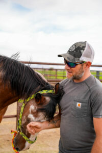 Cage connects with a favorite horse, Geronimo.