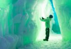 Child in front of Ice Castles