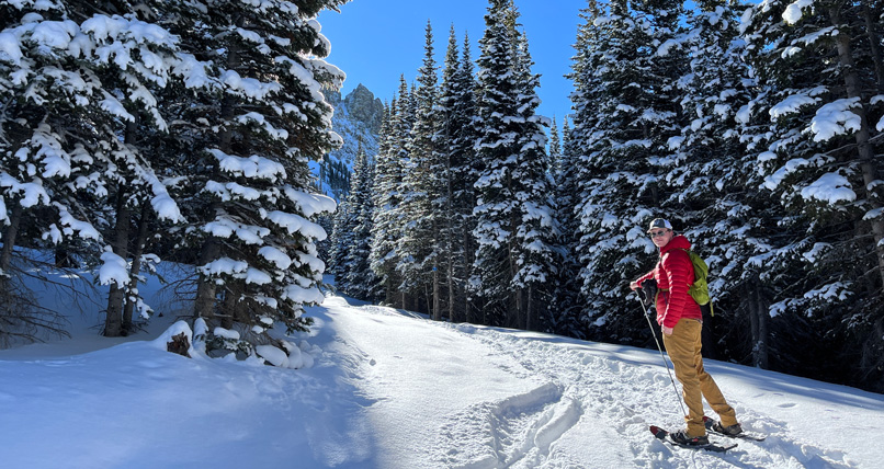 Young woman pictured snowshoeing