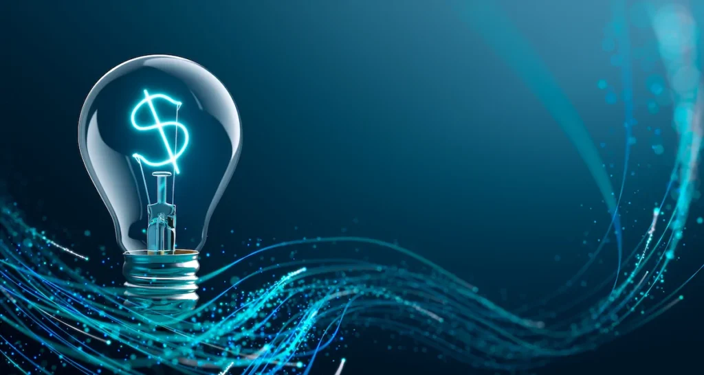 A light bulb with a glowing dollar sign filament is set against a blue background with abstract digital waves in the foreground.